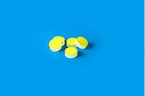 Picture of 11mm (7/16") Diameter Low Bleed Yellow PTFE/Cream Silicone Septa, 3mm Thick, Max Temp 250°C